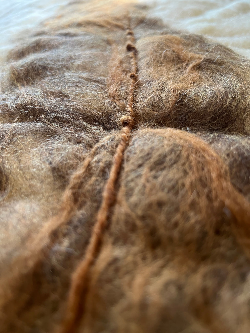Detailed view of natural wool felt showing texture, craftsmanship and acoustic qualities. Each piece is unique and handmade.
