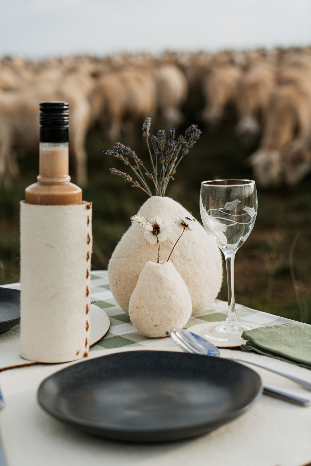 Natural wool vases in rustic outdoor table setting, artisan decor for hospitality and countryside interiors