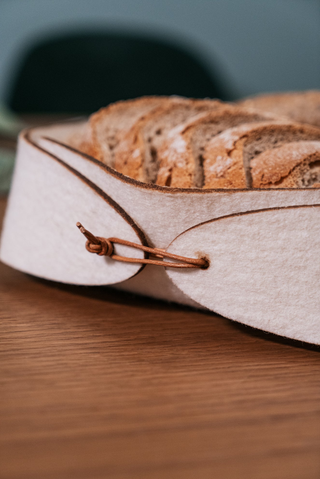 Minimalist table setting with natural wool basket, artisan tableware for elegant homes and boutique hotels