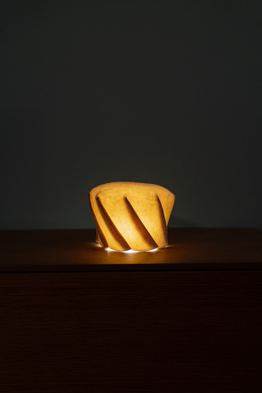 Warm wool bedside lamp for reading, natural lighting for cozy interiors and boutique hotel rooms