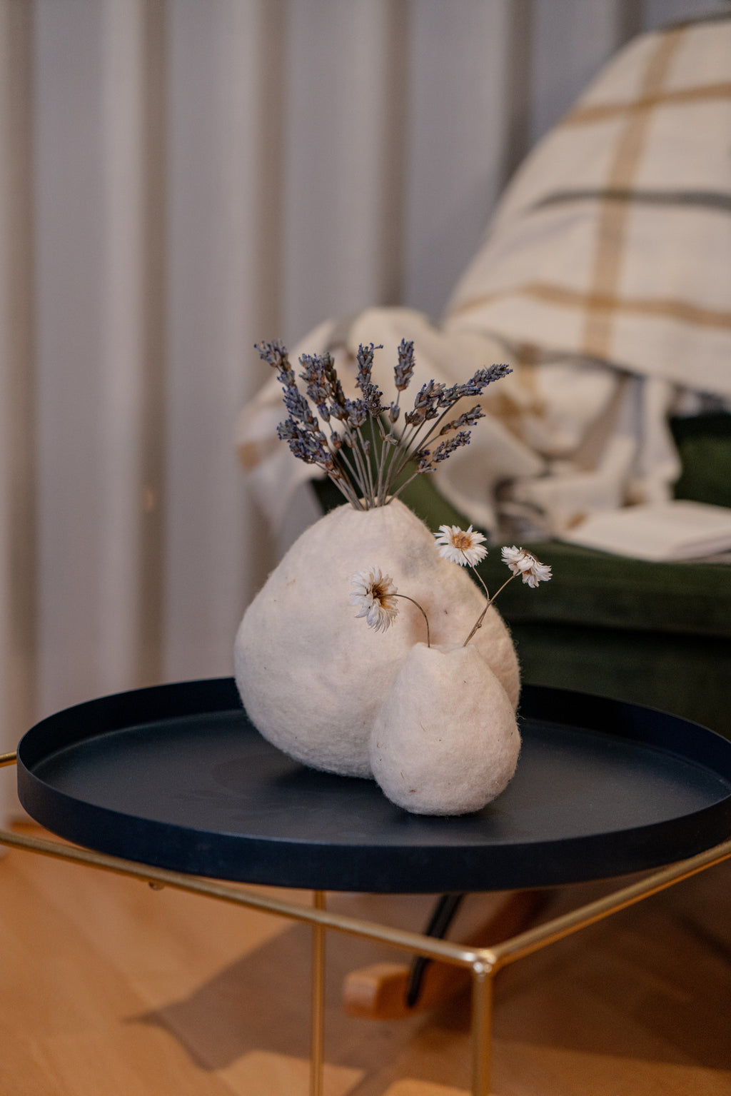 Handmade wool vases in warm living room interior, natural decoration for boutique hotels, retreats and slow living spaces