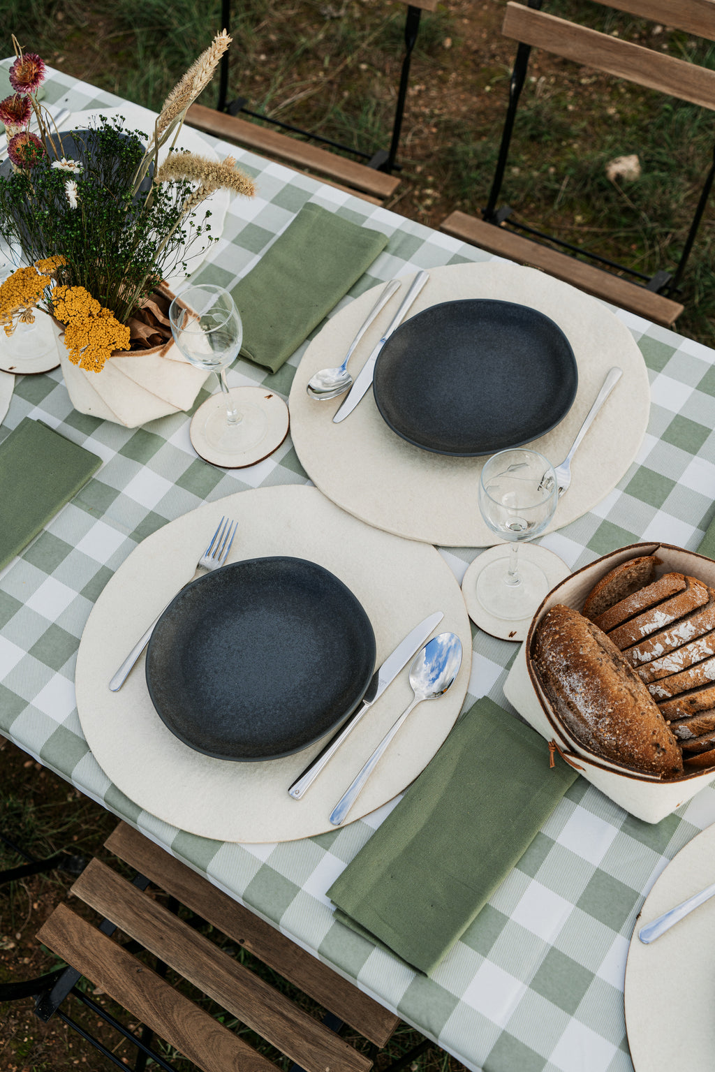 Minimalist rustic table setting with wool placemats, natural decor for sustainable homes, hotels and restaurants
