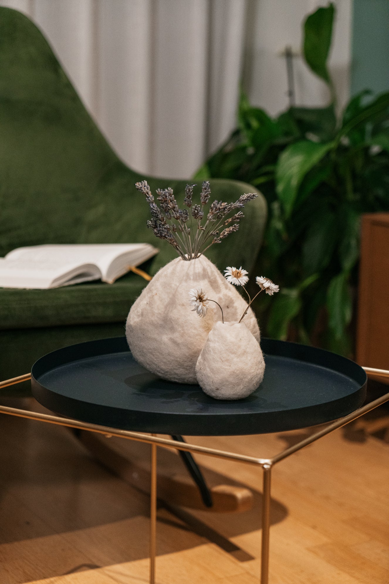 Cozy interior styling with handmade wool vases, natural decoration for reading corner and warm interiors